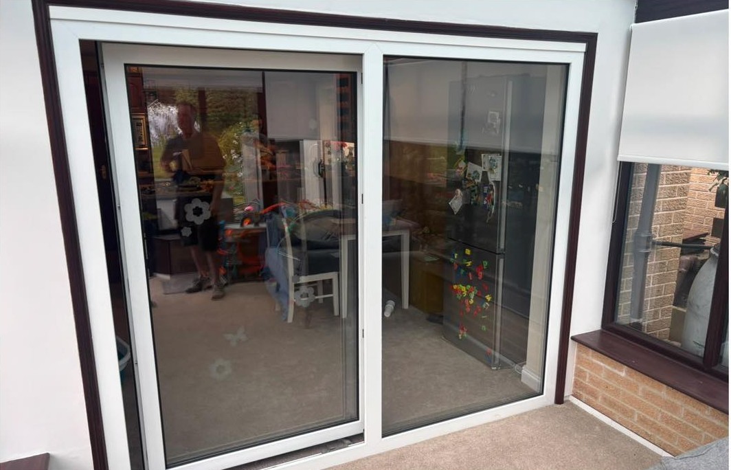 An old white sliding patio door
