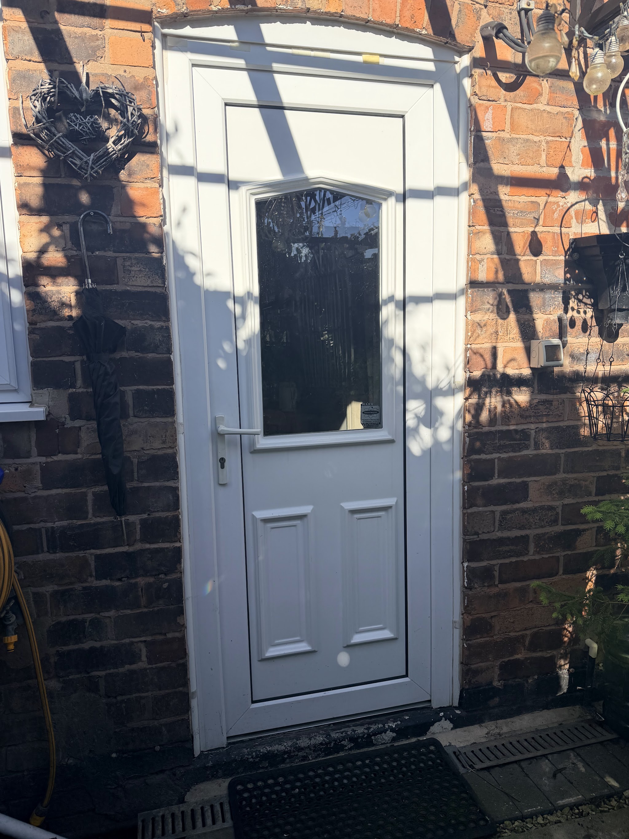 An old white UPVC back door