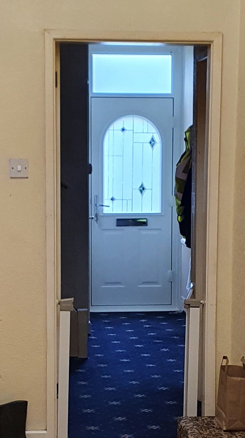 A new front door seen from inside the hallway