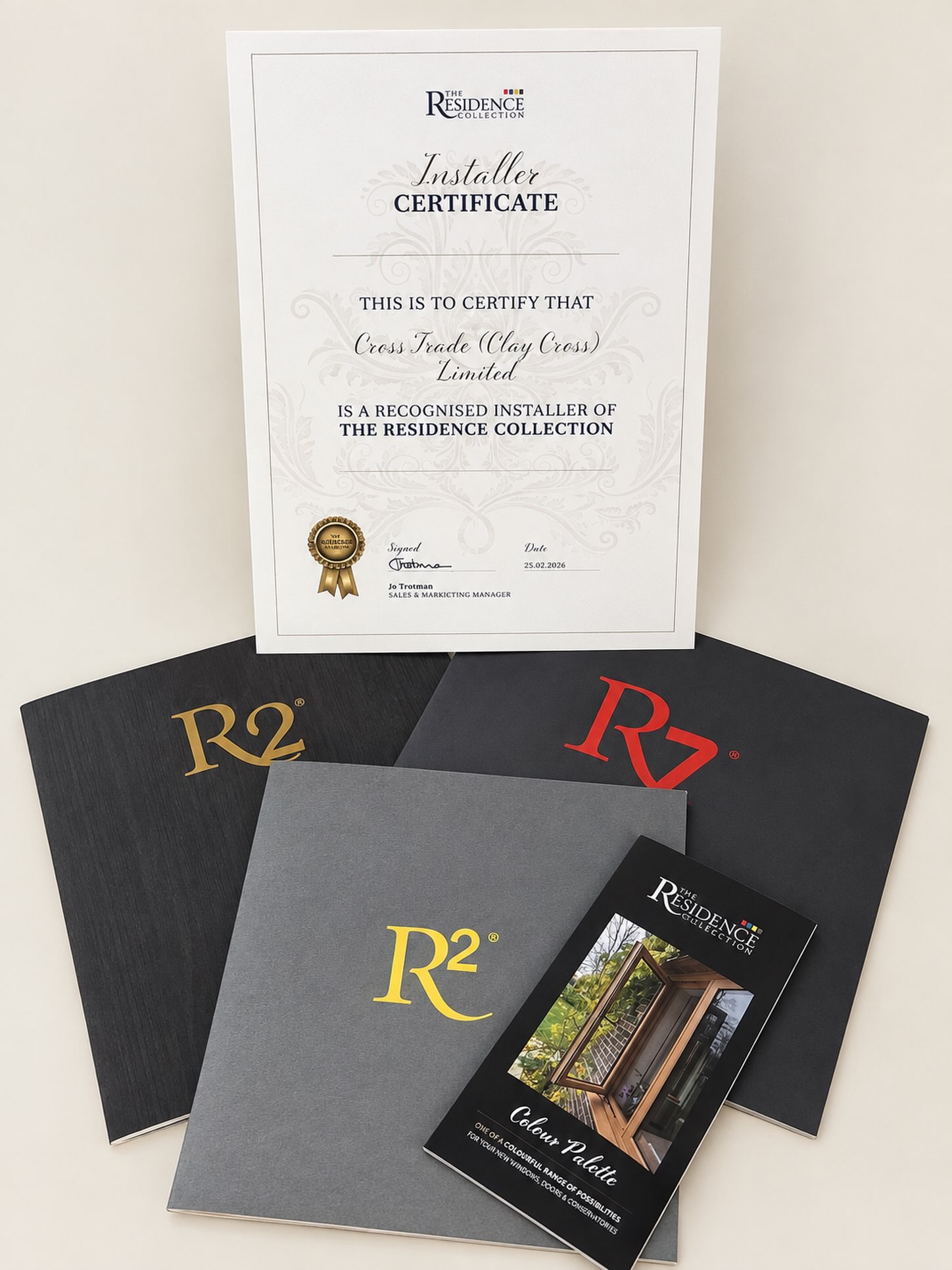 Installer certificate stating Cross Trade (Clay Cross) Limited is a recognised installer of The Residence Collection, dated 25 February 2026, with R2 and R7 brochures
